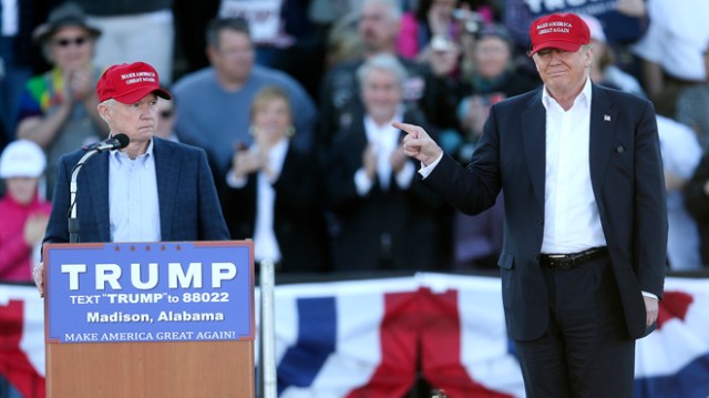 Republican presidential candidate Donald Trump, right, gestures as Sen. Jeff Sessions, R-Ala., speaks during a rally Sunday, Feb. 28, 2016, in Madison, Ala. (AP Photo/John Bazemore)